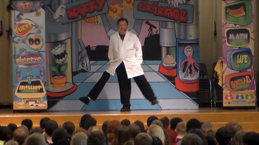 STEM science school assembly performer Cris Johnson walking with 3 legs