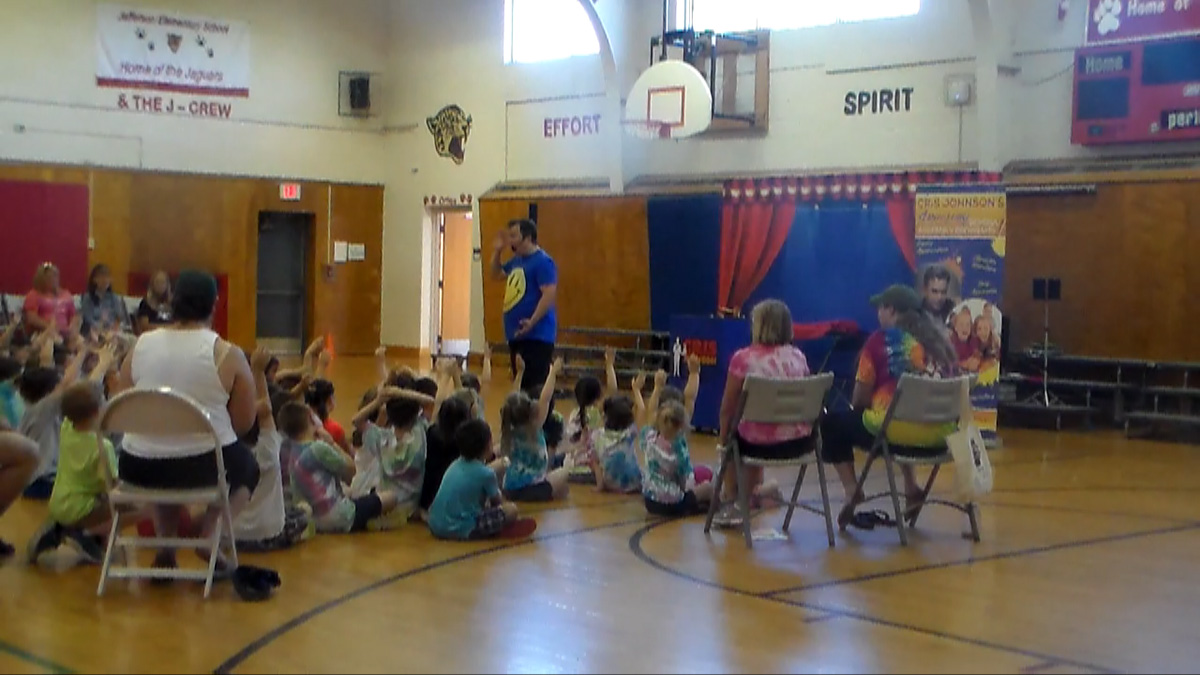 kids at a field day school assembly magic show