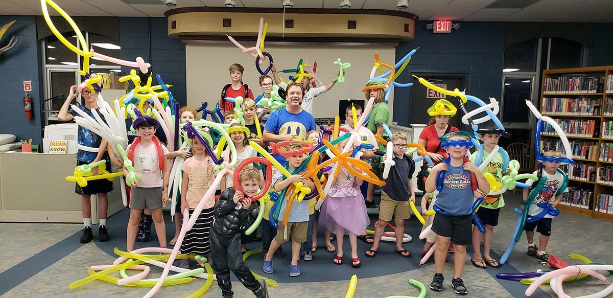 kids with school assembly presenter Cris Johnson's balloon workshop