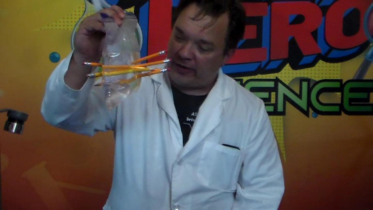 School Assembly Presenter Cris Johnson performing a STEM science experiment for kids